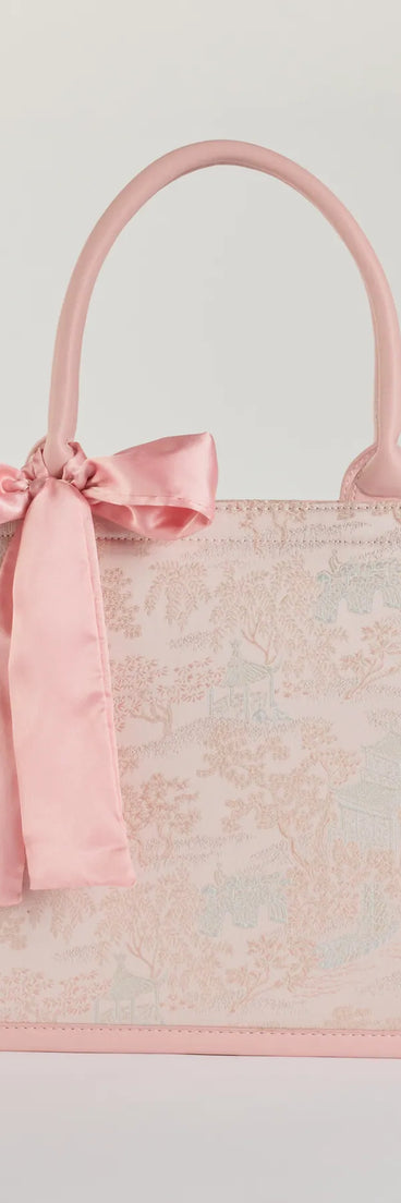 Style your vibe in seconds with the Scenic Embroidered Satin Bow Tote Bag in pink, a fashion accessories essential that completes any outfit with ease.