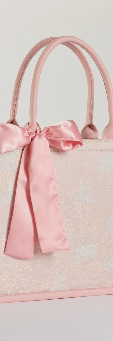Get inspired with the Scenic Embroidered Satin Bow Tote Bag, a feed-worthy pink piece that’s part of Windsor's updated and curated women’s clothing edit packed with must-have fall outfit ideas.