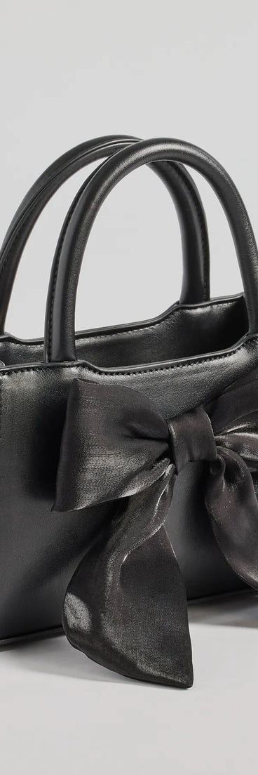 Get inspired with the Tres Chic Tulle Bow Faux Leather Handbag, a feed-worthy black piece that’s part of Windsor's updated and curated women’s clothing edit packed with must-have fall outfit ideas.