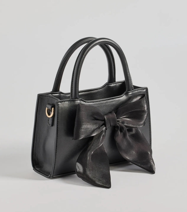 Get inspired with the Tres Chic Tulle Bow Faux Leather Handbag, a feed-worthy black piece that’s part of Windsor's updated and curated women’s clothing edit packed with must-have fall outfit ideas.