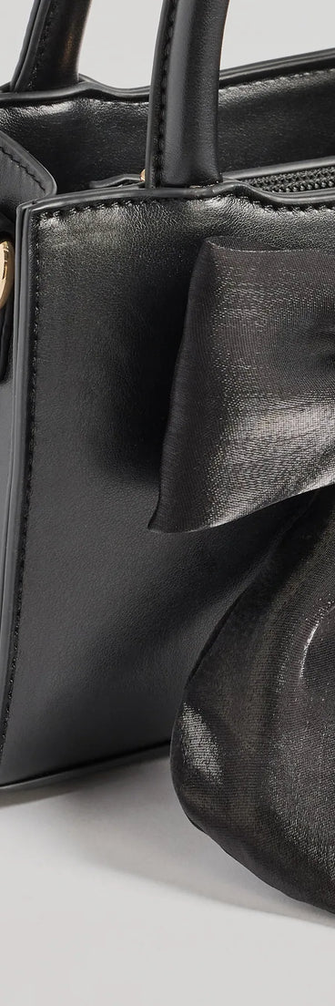 Get inspired with the Tres Chic Tulle Bow Faux Leather Handbag, a feed-worthy black piece that’s part of Windsor's updated and curated women’s clothing edit packed with must-have fall outfit ideas.