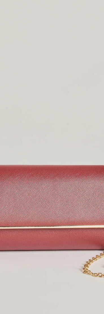 The Sleek Sophistication Faux Leather Clutch in burgundy is a women's workwear essential with an elevated fabric and chic silhouette, ideal for layering and versatile enough to take your look from office chic to going-out ready!