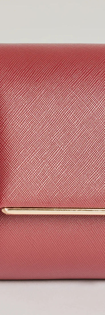 The Sleek Sophistication Faux Leather Clutch in burgundy is a women's workwear piece offering a trendy style and unique accents, perfect for effortlessly creating an outfit-of-the-day look that transitions your office look to going-out ready.