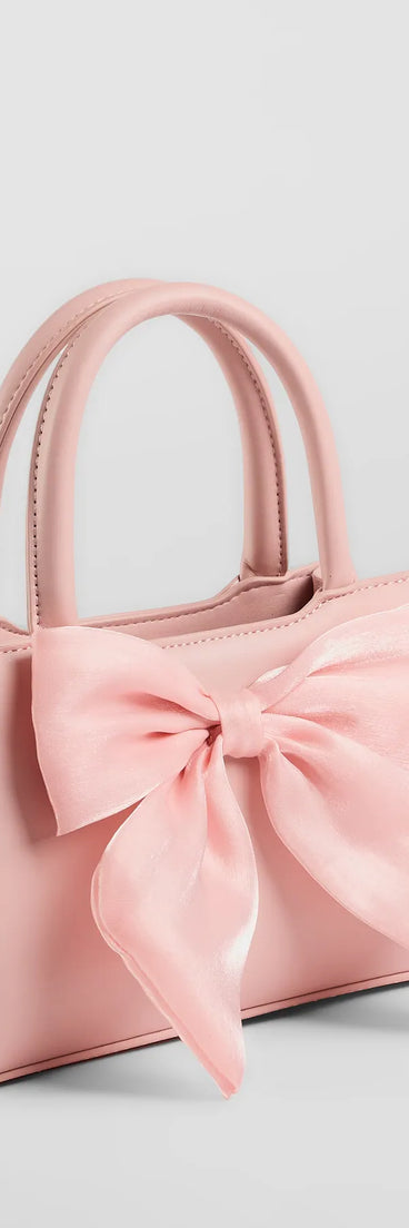 Get inspired with the Tres Chic Tulle Bow Faux Leather Handbag, a feed-worthy pink piece that’s part of Windsor's updated and curated women’s clothing edit packed with must-have fall outfit ideas.
