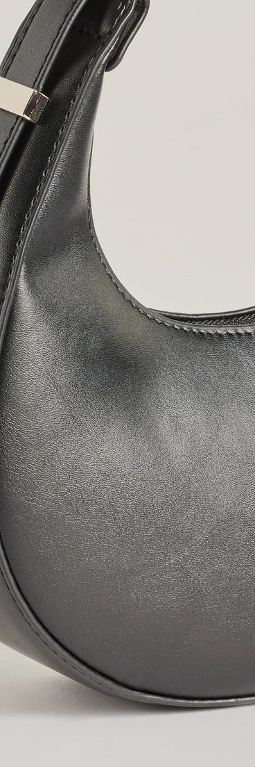 The Iconic Glam Half-Moon Shoulder Bag in black is a women's workwear piece offering a trendy style and unique accents, perfect for effortlessly creating an outfit-of-the-day look that transitions your office look to going-out ready.