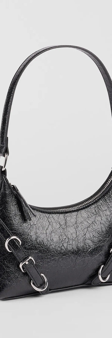 The Girl On The Run Buckle Shoulder Bag in black brings edge and energy to your vibe, ready to elevate any festival look or concert outfit.