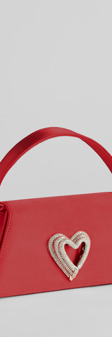 Whether you're dressing up for a romantic date or a Galentine's event, the Sparkle Romance Rhinestone Heart Handbag in red is the perfect accessory to elevate your Valentine's Day outfit.