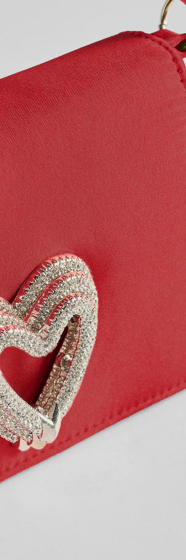 Whether you're dressing up for a romantic date or a Galentine's event, the Sparkle Romance Rhinestone Heart Handbag in red is the perfect accessory to elevate your Valentine's Day outfit.