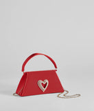 Whether you're dressing up for a romantic date or a Galentine's event, the Sparkle Romance Rhinestone Heart Handbag in red is the perfect accessory to elevate your Valentine's Day outfit.