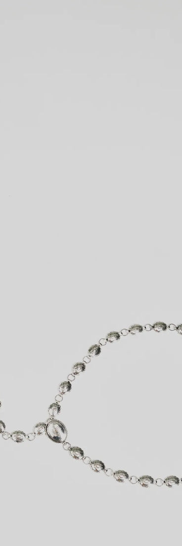 The Cutest Cowgirl Mini Concho Chain Belt in silver brings edge and energy to your vibe, ready to elevate any festival look or concert outfit.