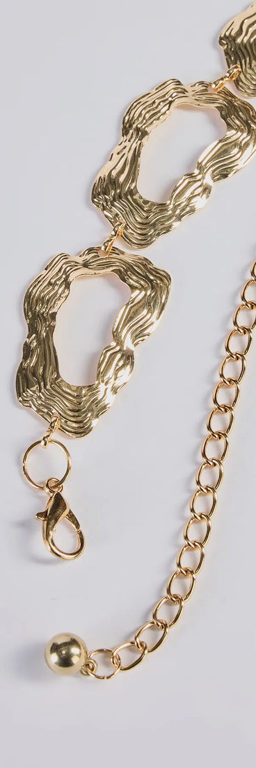 The Boldly Chic Abstract Hammered Metal Chain Belt in gold brings edge and energy to your vibe, ready to elevate any festival look or concert outfit.