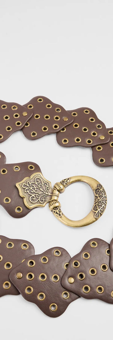 The Western Mood Statement Buckle Medallion Belt in brown brings edge and energy to your vibe, ready to elevate any festival look or concert outfit.