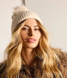 Add a touch of seasonal charm to your winter wardrobe with the Stay Toasty Bow And Pom Knit Beanie, a ivory cold-weather accessory that effortlessly completes your seasonal looks!