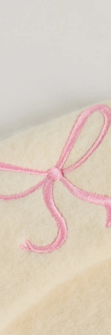 Add a touch of seasonal charm to your winter wardrobe with the So Chic Bow Detail Faux Wool Beret, a ivory cold-weather accessory that effortlessly completes your seasonal looks!