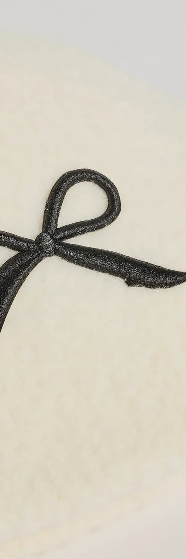 Add a touch of seasonal charm to your winter wardrobe with the Adorably Cozy Bow Detail Faux Wool Bucket Hat, a white cold-weather accessory that effortlessly completes your seasonal looks!