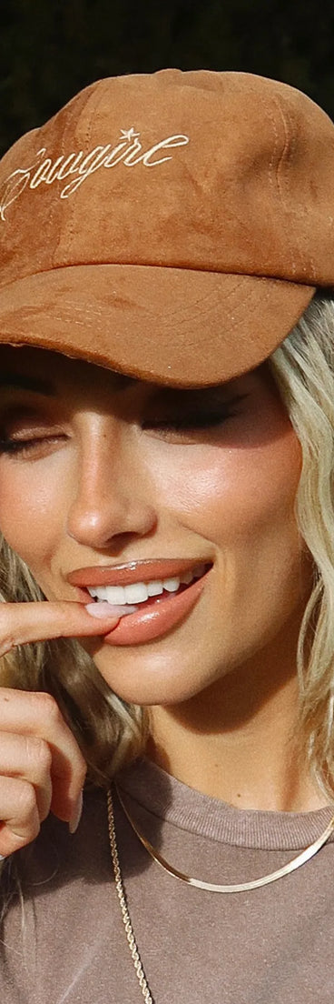 The Faux Suede Cowgirl Script Baseball Cap in cognac brings edge and energy to your vibe, ready to elevate any festival look or concert outfit.