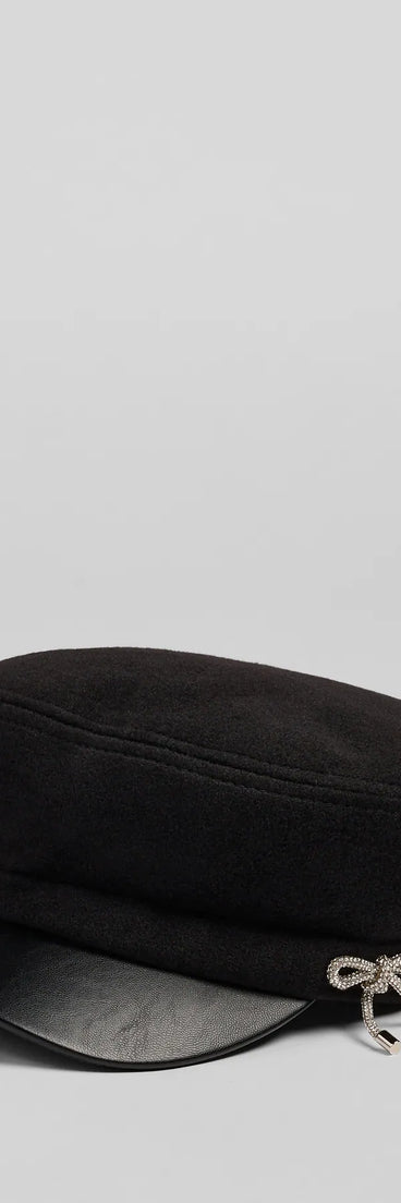 Style your vibe in seconds with the Glam In The City Rhinestone Bow Cabbie Hat in black, a fashion accessories essential that completes any outfit with ease.