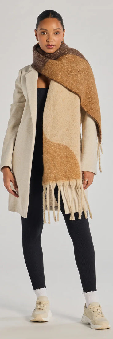 Add a touch of seasonal charm to your winter wardrobe with the Abstract Appeal Blanket Scarf, a cold-weather accessory that effortlessly completes your seasonal looks!