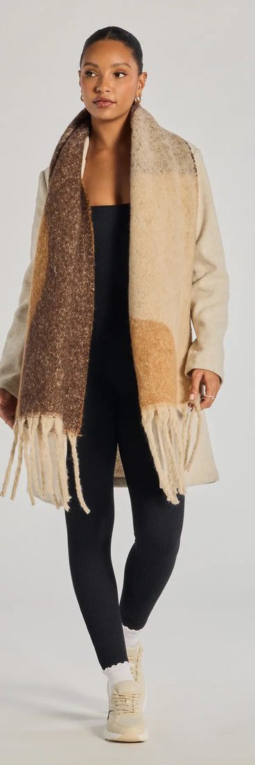 Add a touch of seasonal charm to your winter wardrobe with the Abstract Appeal Blanket Scarf, a cold-weather accessory that effortlessly completes your seasonal looks!