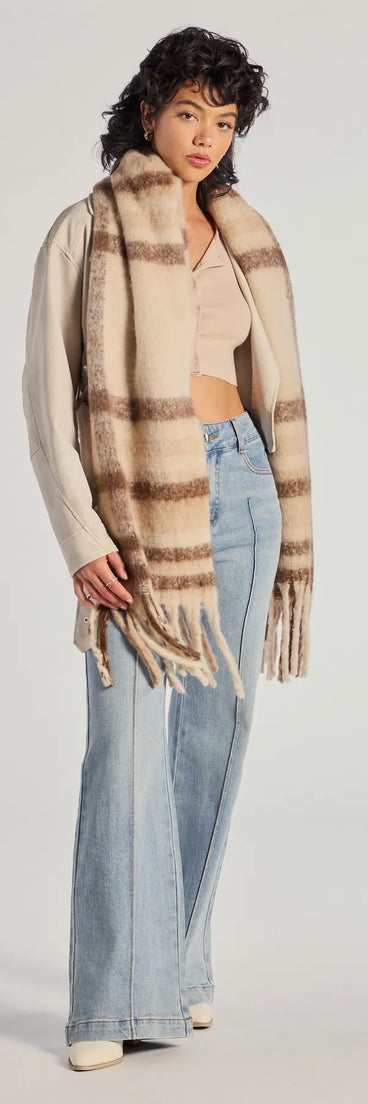 Add a touch of seasonal charm to your winter wardrobe with the Plaid Moment Blanket Scarf, a cold-weather accessory that effortlessly completes your seasonal looks!