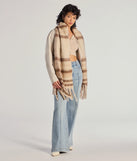 Add a touch of seasonal charm to your winter wardrobe with the Plaid Moment Blanket Scarf, a cold-weather accessory that effortlessly completes your seasonal looks!