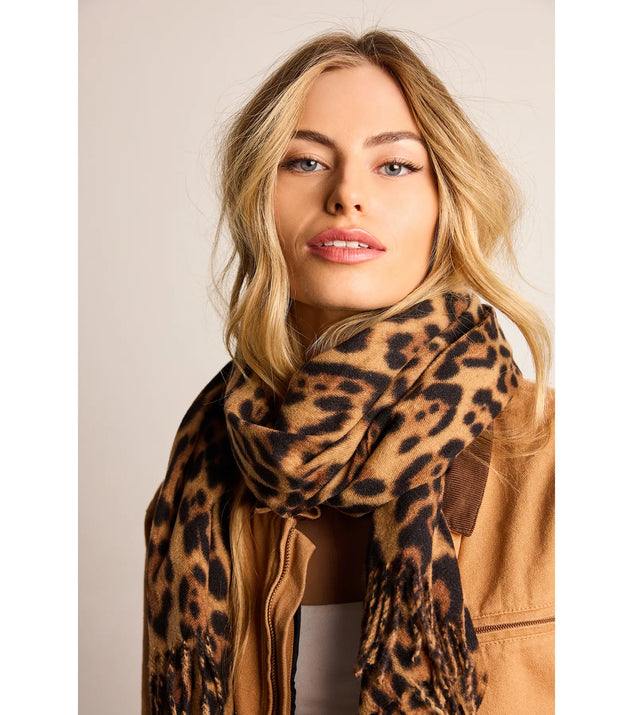 Add a touch of seasonal charm to your winter wardrobe with the Fierce And Fab Leopard Print Scarf, a leopard cold-weather accessory that effortlessly completes your seasonal looks!