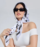 Stay on-trend this season with the Dotted Darling Polka Dot Satin Scarf in white, a must-have for creating stylish and effortless spring outfits for women.