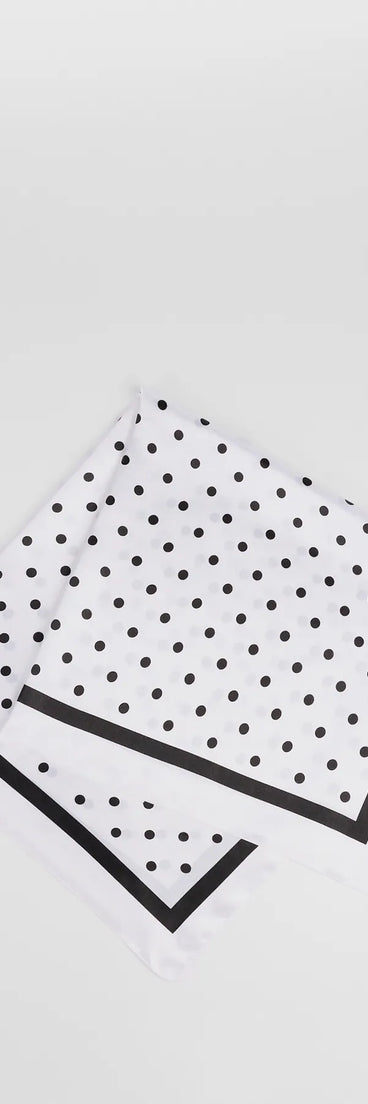 Stay on-trend this season with the Dotted Darling Polka Dot Satin Scarf in white, a must-have for creating stylish and effortless spring outfits for women.