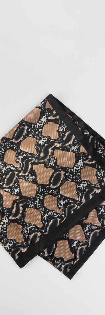 The Slithery Style Snake Print Satin Scarf in snake print brings edge and energy to your vibe, ready to elevate any festival look or concert outfit.