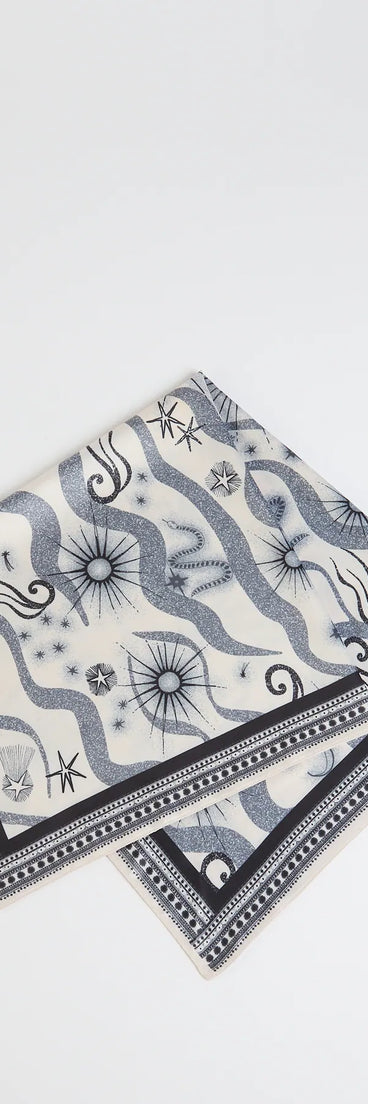 The In The Stars Celestial Satin Scarf in black brings edge and energy to your vibe, ready to elevate any festival look or concert outfit.