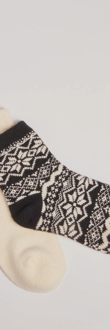 Add a touch of seasonal charm to your winter wardrobe with the Cozy Fair Isle Two-Pack Socks, a black cold-weather accessory that effortlessly completes your seasonal looks!