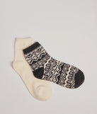 Add a touch of seasonal charm to your winter wardrobe with the Cozy Fair Isle Two-Pack Socks, a black cold-weather accessory that effortlessly completes your seasonal looks!