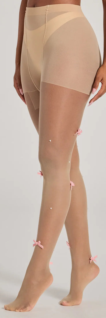 Sweetly Chic Faux Pearl And Bow Sheer Tights, a trendy nude addition to women's going-out outfits, is ideal for Christmas party outfits, chic NYE attire, or winter night-out looks that keep you on-trend!