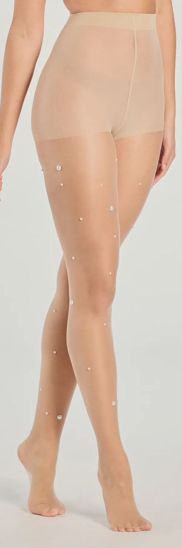 Whether you're dressing up for a romantic date or a Galentine's event, the All In The Details Faux Pearl Sheer Tights in nude are the perfect accessory to elevate your Valentine's Day outfit.