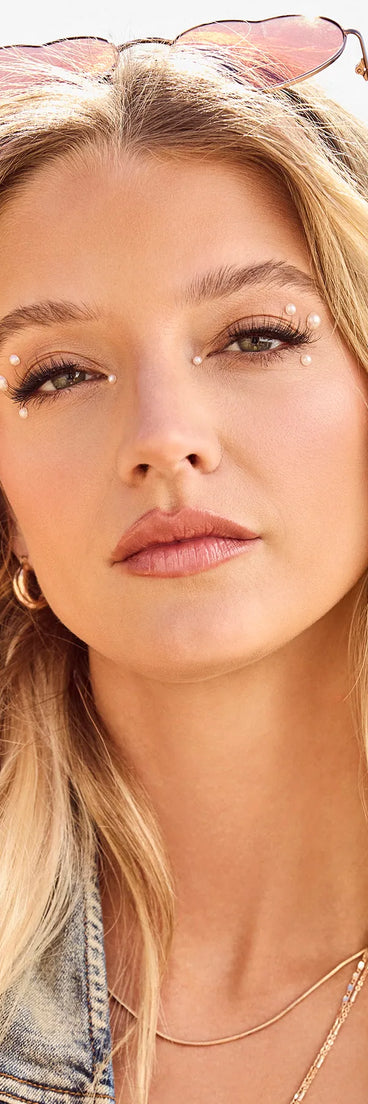 The Luxe Glow Iridescent And Faux Pearl Face Gemstones brings edge and energy to your vibe, ready to elevate any festival look or concert outfit.