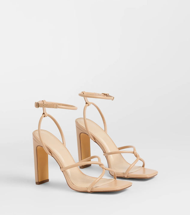 The So Elegant Twist Strappy Block Heels in nude brings sleek style to any graduation outfit, from cap and gown to after-party.