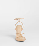 The So Elegant Twist Strappy Block Heels in nude brings sleek style to any graduation outfit, from cap and gown to after-party.