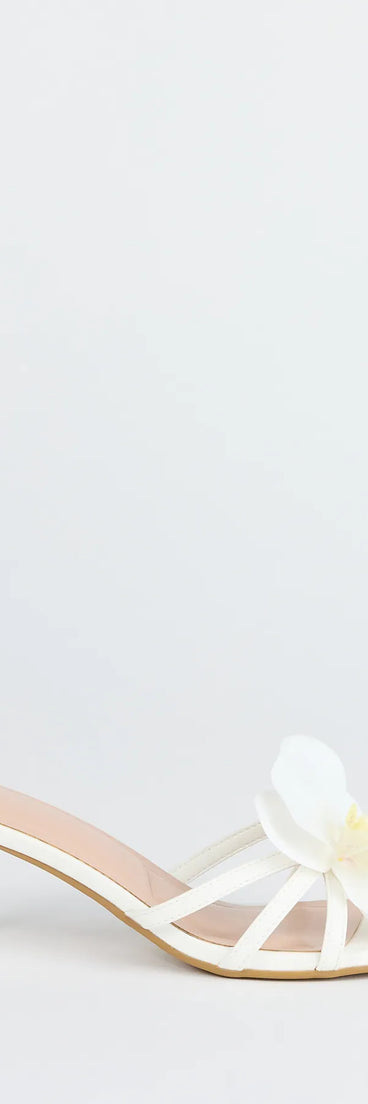 Elevate warm-weather looks with Vacay Ready Flower Strap Stiletto Mules in white, a pair of trendy sandals bringing chic, modern flair to every step.