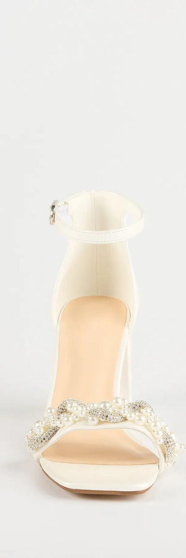 Elevate warm-weather looks with Chic Stride Rhinestone And Pearl Block Heels in white, a pair of trendy sandals bringing chic, modern flair to every step.