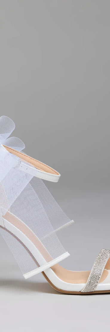 Elevate warm-weather looks with Tied With A Bow Stiletto Heels in white, a pair of trendy sandals bringing chic, modern flair to every step.