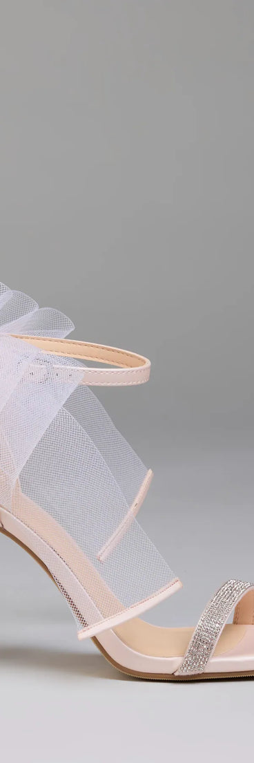 Elevate warm-weather looks with Tied With A Bow Stiletto Heels in pink, a pair of trendy sandals bringing chic, modern flair to every step.