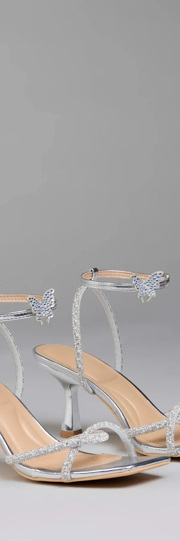 Elevate warm-weather looks with Fab Icon Butterfly Rhinestone Stiletto Heels in silver, a pair of trendy sandals bringing chic, modern flair to every step.