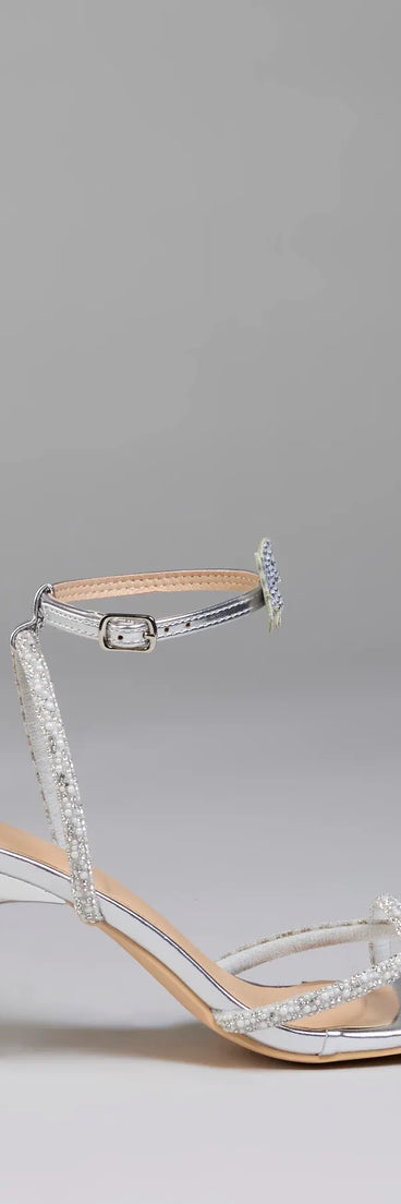 Elevate warm-weather looks with Fab Icon Butterfly Rhinestone Stiletto Heels in silver, a pair of trendy sandals bringing chic, modern flair to every step.