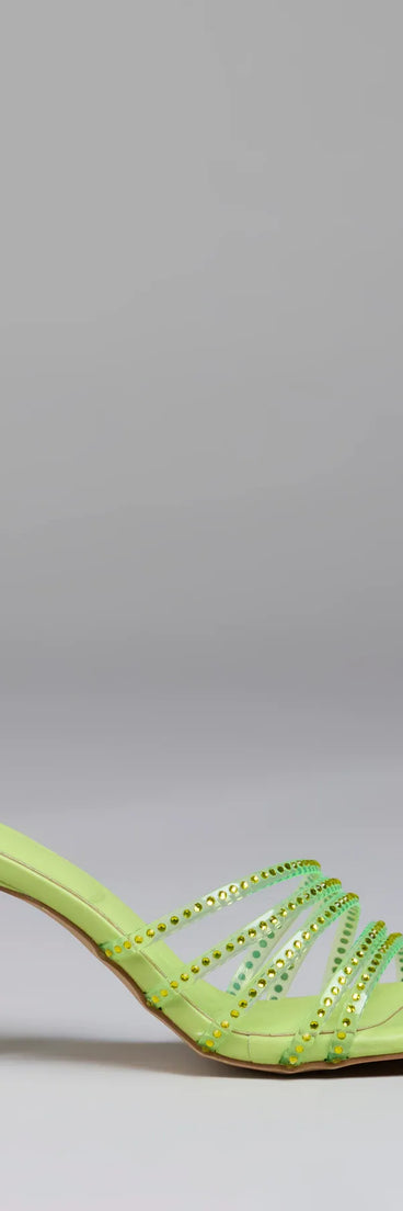 Elevate warm-weather looks with Alluring Strappy Stud Stiletto Mules in green, a pair of trendy sandals bringing chic, modern flair to every step.