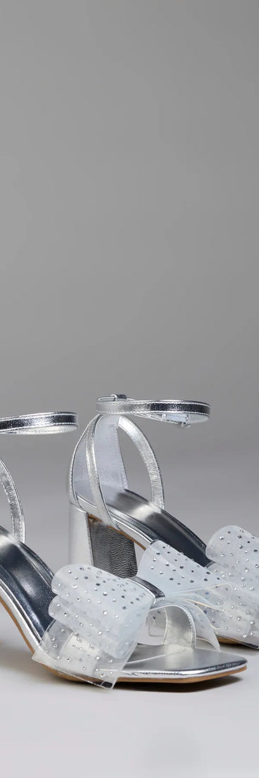 Step into style with the Fancy Looks Rhinestone Bow Metallic Block Heels, silver heels made to complete your Windsor look with comfort and glam in mind.