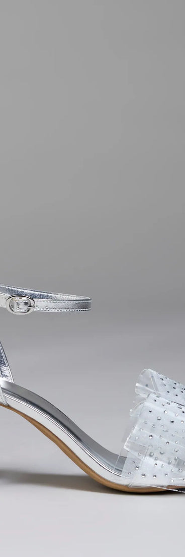 Elevate warm-weather looks with Fancy Looks Rhinestone Bow Metallic Block Heels in silver, a pair of trendy sandals bringing chic, modern flair to every step.