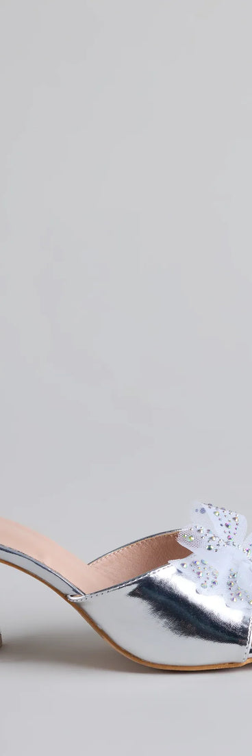 Elevate warm-weather looks with Sweet Glamour Rhinestone Bow Mules in silver, a pair of trendy sandals bringing chic, modern flair to every step.