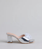 Elevate warm-weather looks with Sweet Glamour Rhinestone Bow Mules in silver, a pair of trendy sandals bringing chic, modern flair to every step.