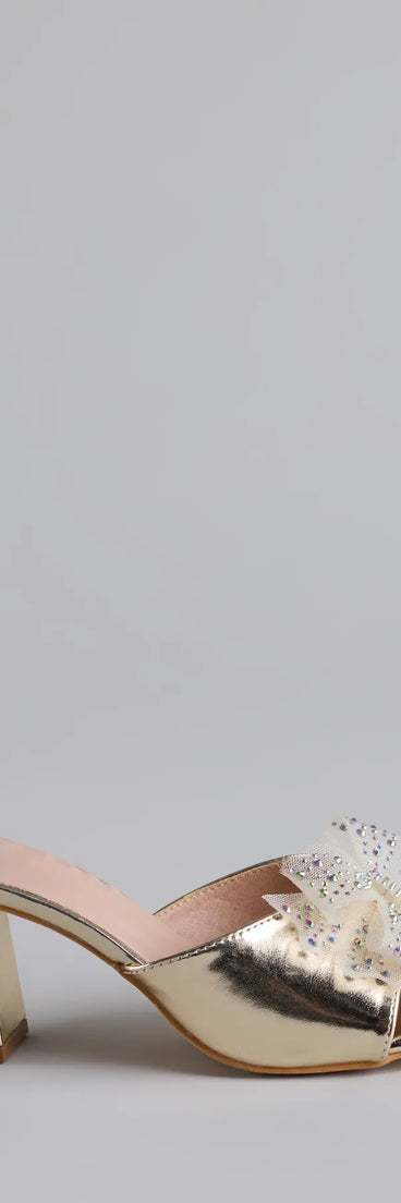 Elevate warm-weather looks with Sweet Glamour Rhinestone Bow Mules in gold, a pair of trendy sandals bringing chic, modern flair to every step.