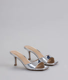 Step into style with the Glam Stunner Stiletto Mules, silver heels made to complete your Windsor look with comfort and glam in mind.
